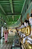 Myanmar - Sagaing, Umin Thounzeh (the 30 Caves), a colourful crescent-shaped colonnade within which there are 45 Buddha images. 